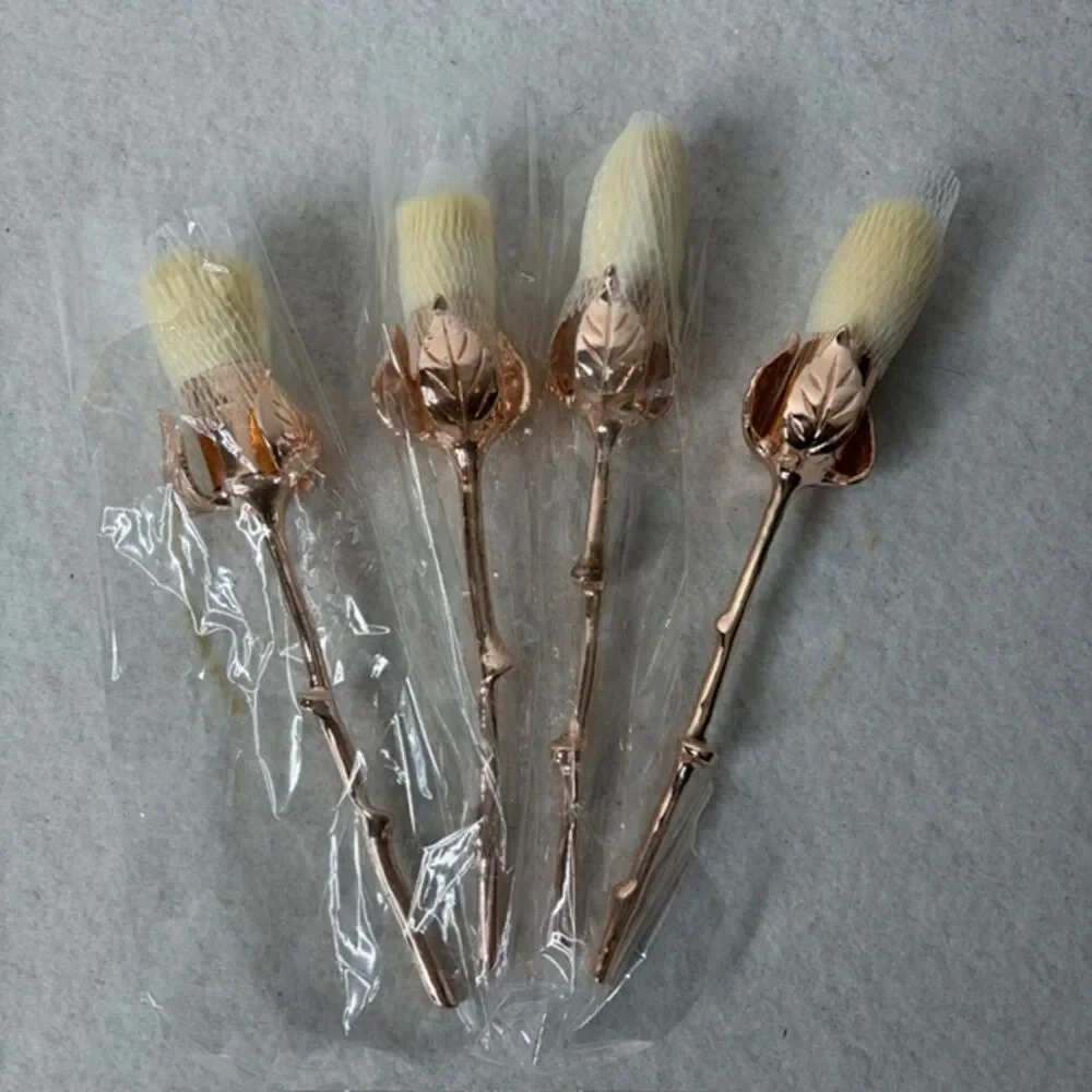 Rose gold floral makeup brush set with elegant rose handles